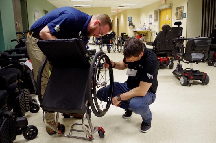 MRT students fixing a wheelchair