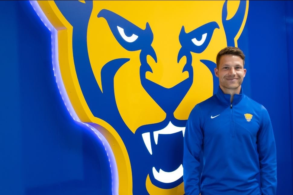 Felix Prossel and Pitt athletics panther logo feature wall