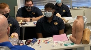 Emergency Medicine students learning about intubation