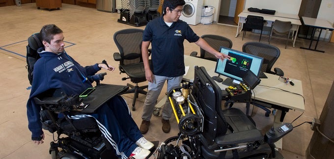 Students working with wheelchair technology