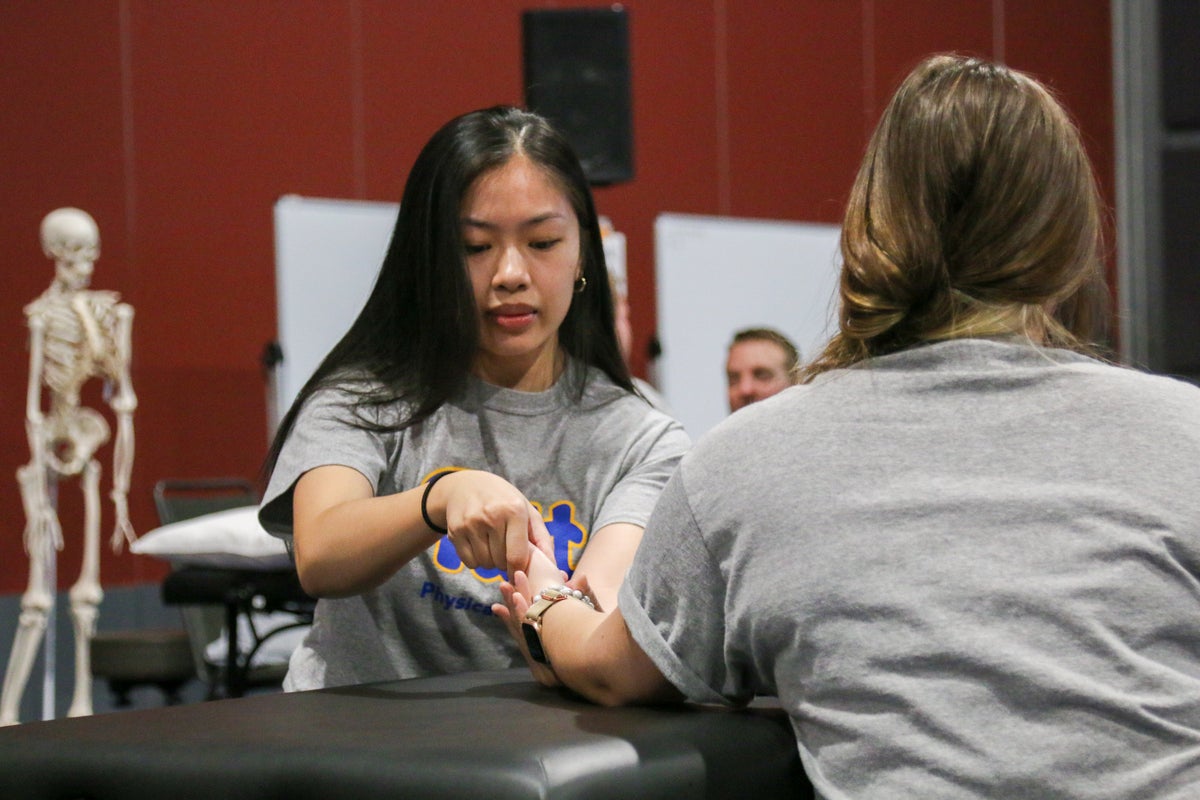 Second-year students performing an assessment of the wrist