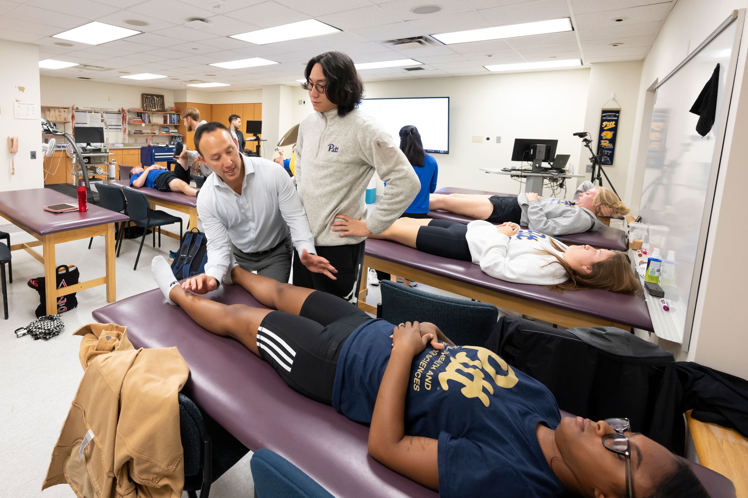 Sports Medicine students learning hands-on techniques from a guest instructor