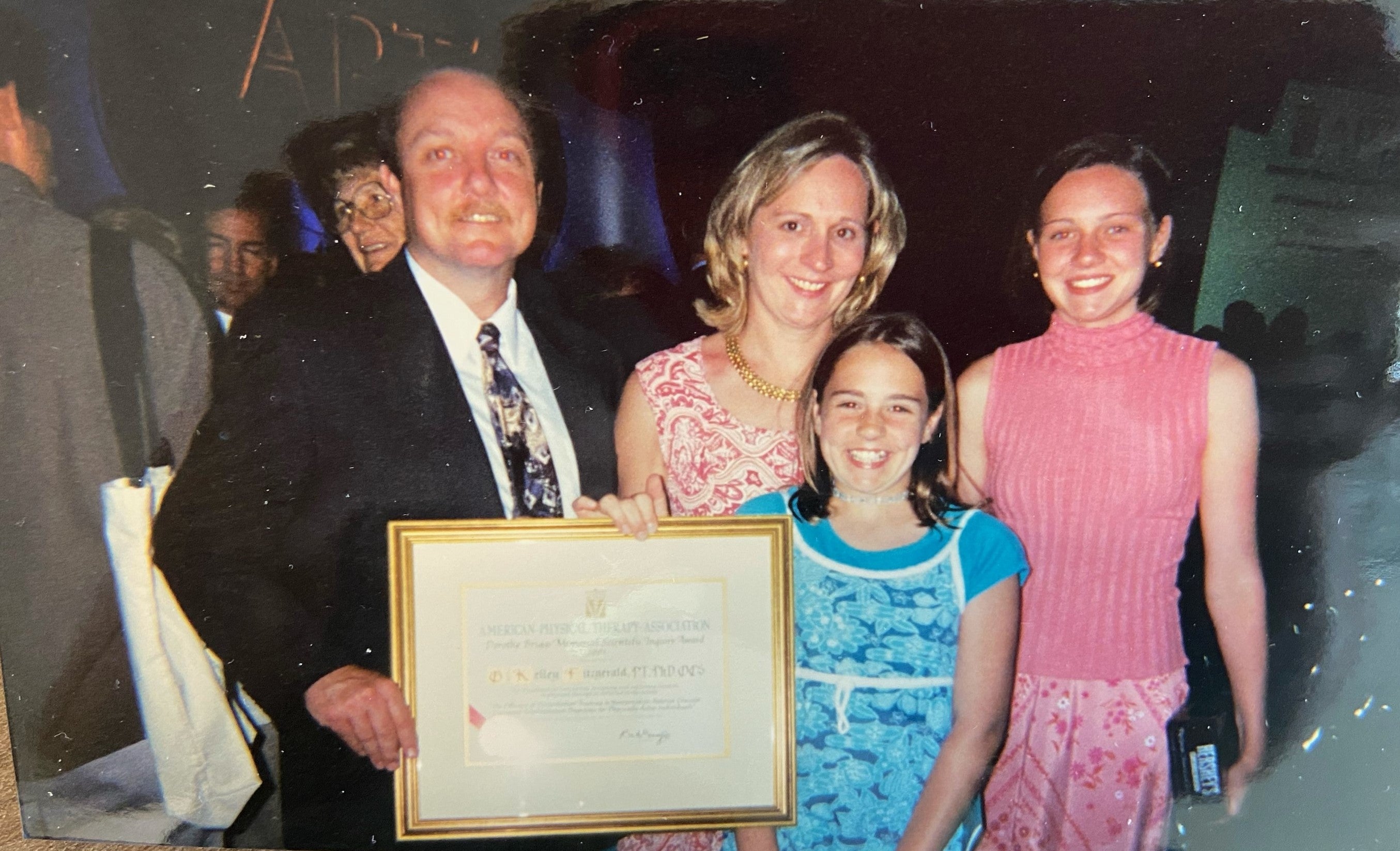 Fitzgerald with his young family as he received the Dorothy Briggs Memorial Scientific Inquiry Award at the national physical therapy association meeting