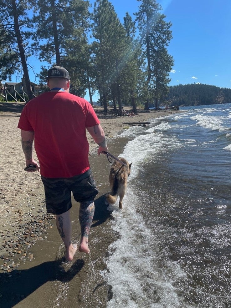 My husband Zack and dog Maia at Coeur D’Alene Lake