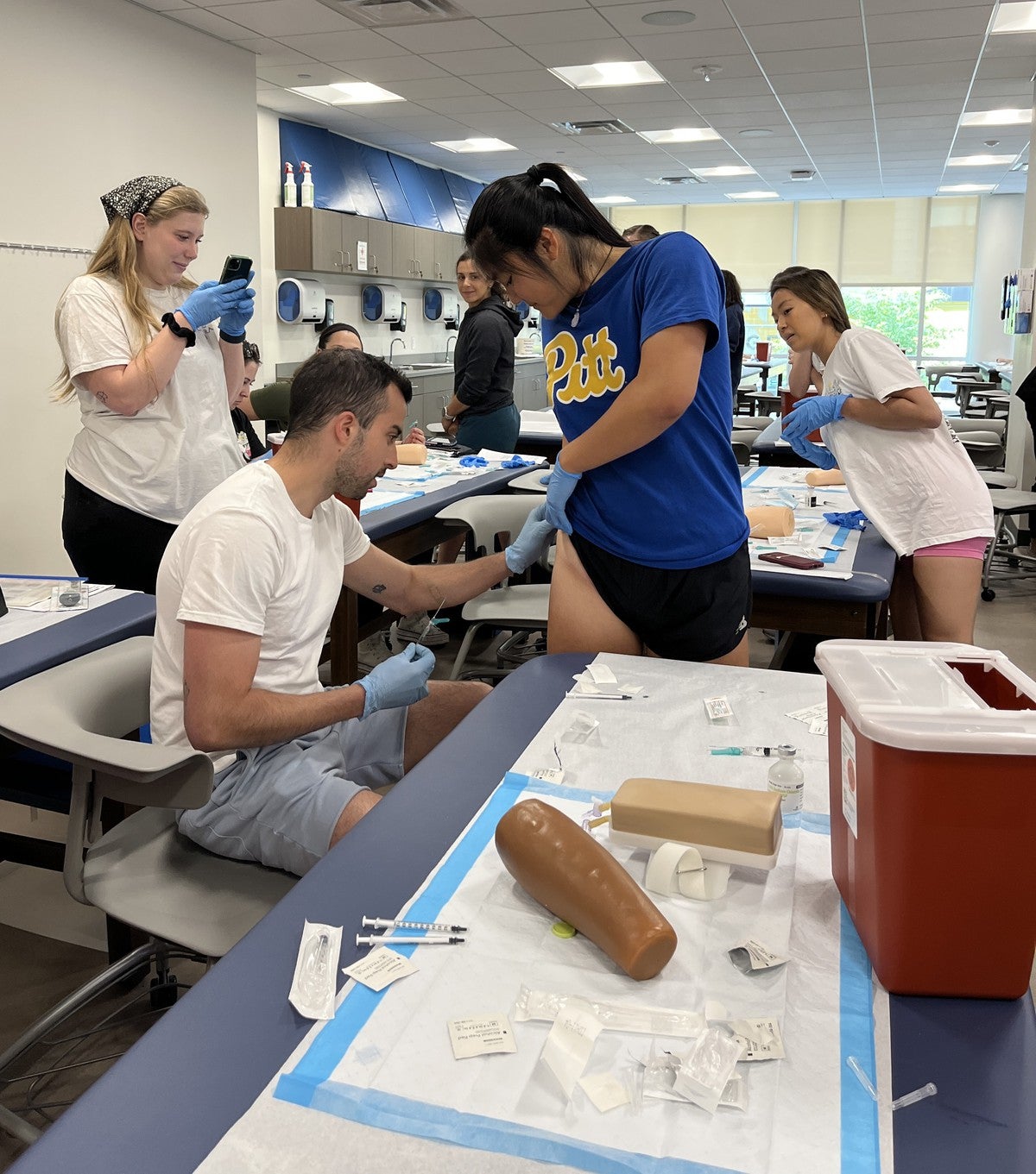 Pitt PAS students giving and receiving ventrogluteal injections