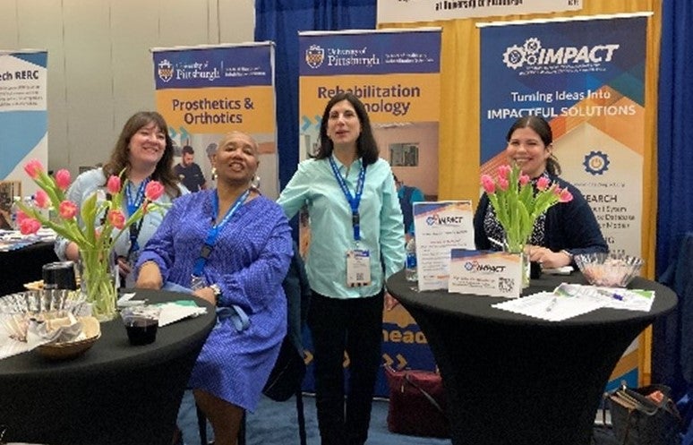 RST faculty and staff gather at the University of Pittsburgh exhibit booth during ISS. Pictured left to right: Paige Altman, Kim Robinson, Associate Professor Patricia Karg and Michelle Zorrilla