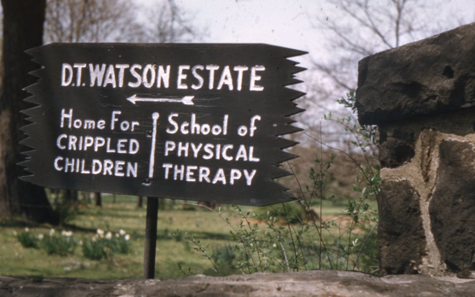 The original sign at the D.T. Watson estate for the School of Physical Therapy