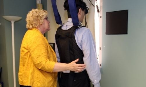 Sue Whitney working with patient model