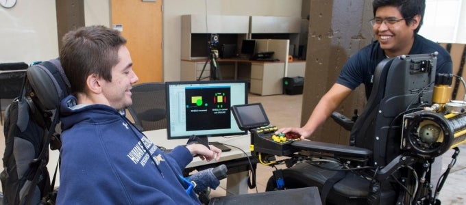 Researchers working on power wheelchairs