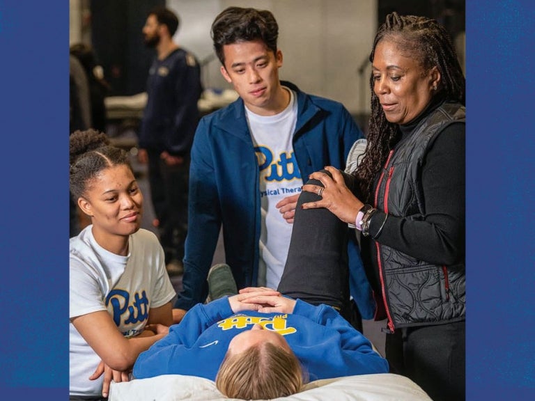 DPT Hybrid students practice hands-on skills under the guidance of alumna and Program Director Kim Nixon-Cave during one of two spring immersions in Pittsburgh