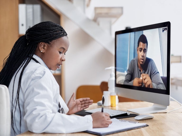 Physician's Assistant on Video Call with Patient