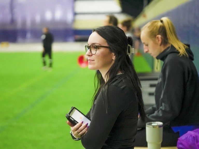 Anna Michalski, Master of Science in Sports Science student at Pitt, working on the field with Pitt Women’s Soccer for her internship in the program. Photo courtesy of Pitt Athletics.