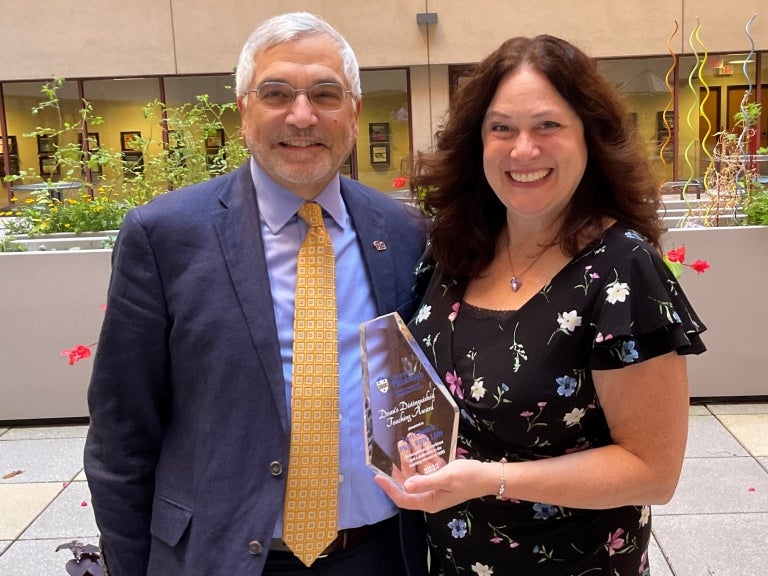 Distinguished Teaching Award Recipient: Lori Cherok, with Dean Anthony Delitto