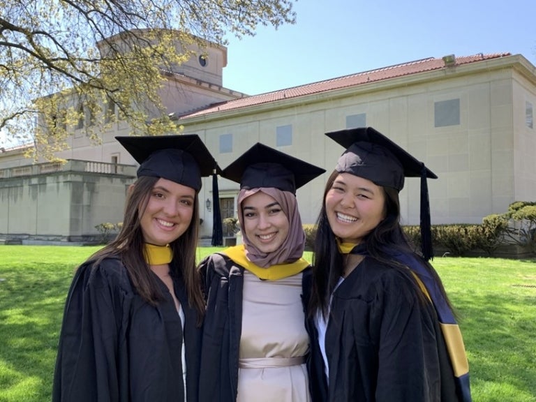 From left to right: Meghan Mulloy, Areeba Khan and Madeline Lee at their MRT graduation.
