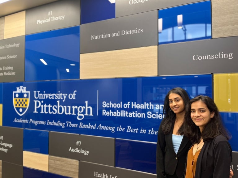 Health Informatics students Zoe Menezes (BSHI ‘25), left, with co-presenter Avani Chhabra (MSHI ‘23), right.