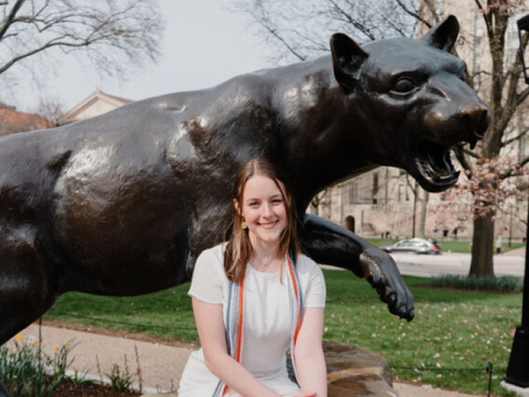 Bracken with the Pitt Panther Statue from her graduation from the CSBA program