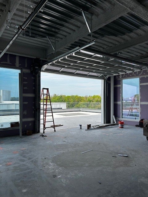 Floor 9 Event Space with the garage doors opened.