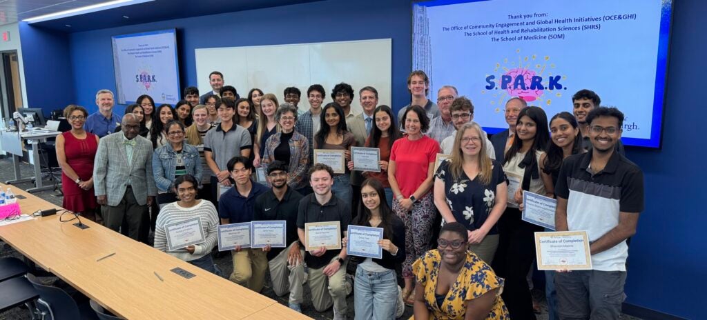 Large group photo of participants at the SPARK event at Pitt SHRS.